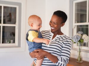 Portrait,Of,Happy,Black,Mother,Holding,Cute,Toddler,Laughing,Together