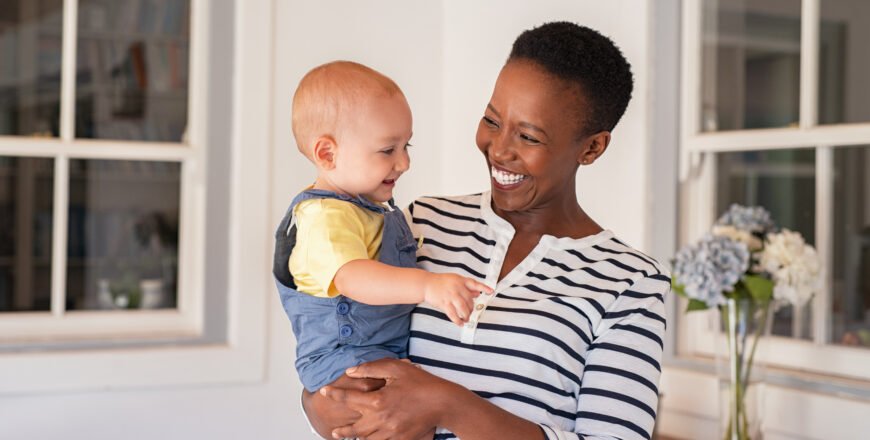 Portrait,Of,Happy,Black,Mother,Holding,Cute,Toddler,Laughing,Together